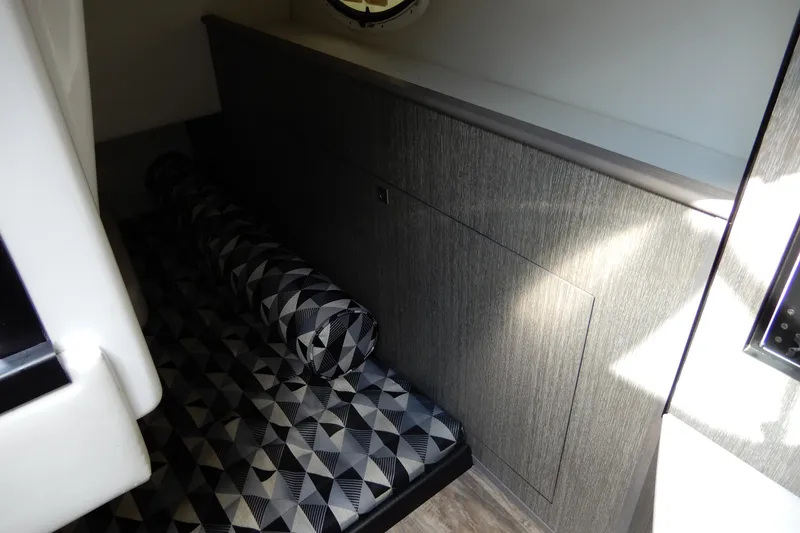 Slide: The Image of Interior cabin of 2022 Monterey 295 Sport Yacht with geometric-patterned upholstery. - 39