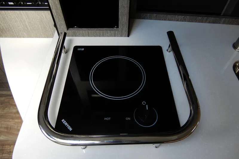 Slide: The Image of Electric cooktop on 2022 Monterey 295 Sport Yacht, featuring sleek design and modern controls. - 42