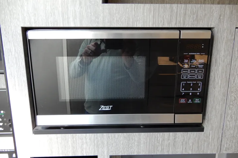 Slide: The Image of Built-in Zest microwave in 2022 Monterey 295 Sport Yacht kitchen. - 43