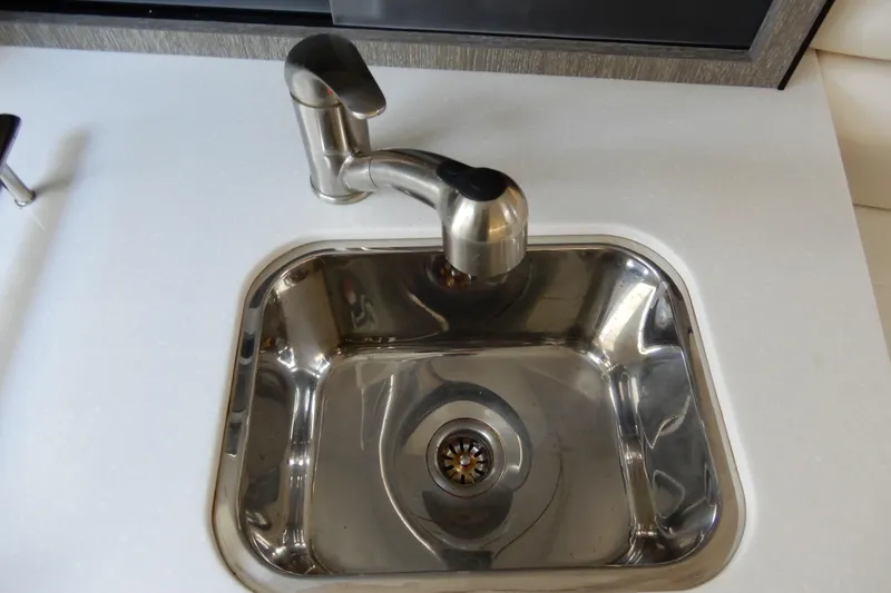 Slide: The Image of Stainless steel sink and faucet on 2022 Monterey 295 Sport Yacht. - 44