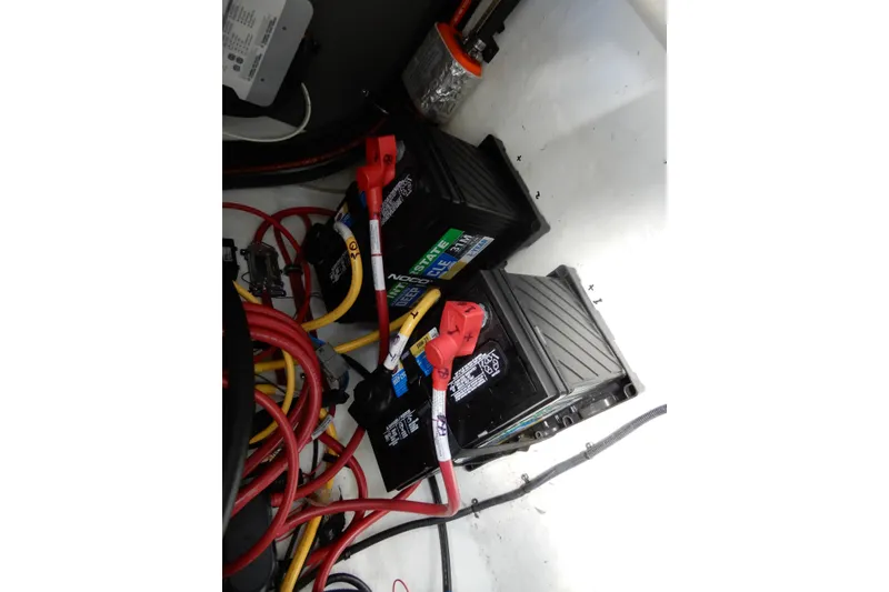 Slide: The Image of Battery compartment of 2022 Monterey 295 Sport Yacht with cables and connectors. - 54