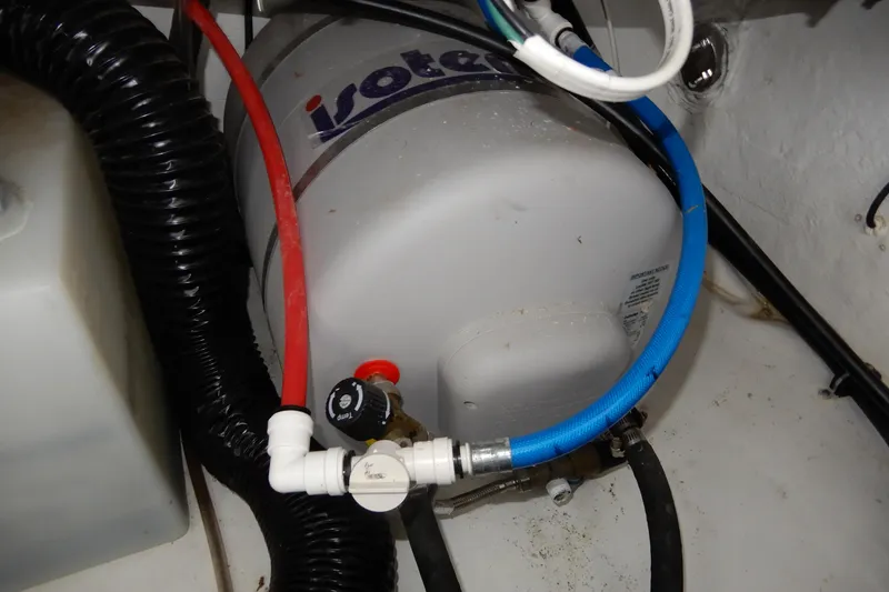 Slide: The Image of Water heater system in 2022 Monterey 295 Sport Yacht engine room. - 56