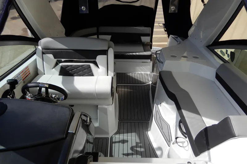 Slide: The Image of Interior of 2022 Monterey 295 Sport Yacht, featuring sleek seating and modern design elements. - 8