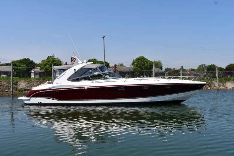 The Image of 2009 Formula 400 Super Sport boat on calm water, showcasing sleek design and luxury features. - 1