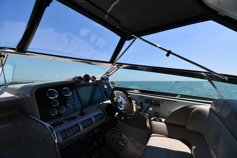 Slide: The Image of Interior view of 2009 Formula 400 Super Sport boat cockpit with ocean backdrop. - 13