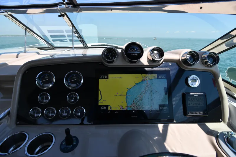 Slide: The Image of Dashboard of a 2009 Formula 400 Super Sport boat with navigation display. - 14