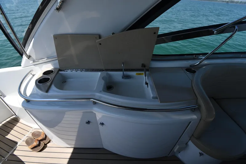 Slide: The Image of 2009 Formula 400 Super Sport yacht interior with sink and seating area. - 22