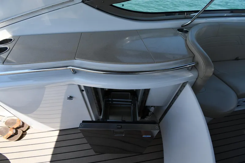 Slide: The Image of 2009 Formula 400 Super Sport yacht interior with open mini fridge and seating area. - 23