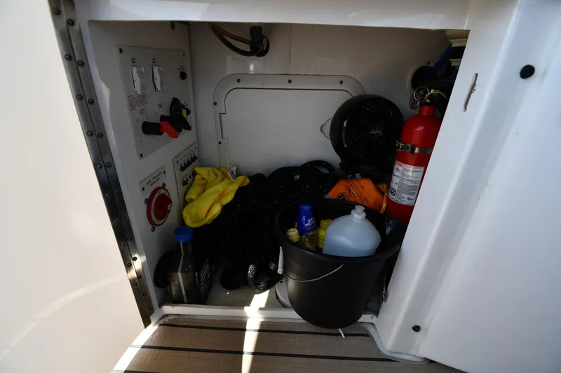 Slide: The Image of Storage compartment in a 2009 Formula 400 Super Sport boat with safety equipment. - 24