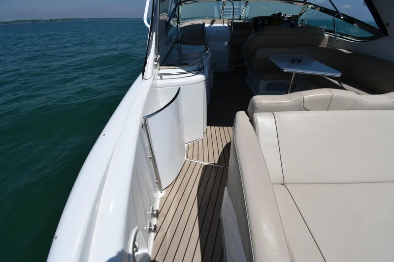 Slide: The Image of 2009 Formula 400 Super Sport yacht interior with beige seating and ocean view. - 25