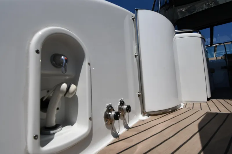 Slide: The Image of 2009 Formula 400 Super Sport yacht deck with sleek white fixtures and wood flooring. - 27