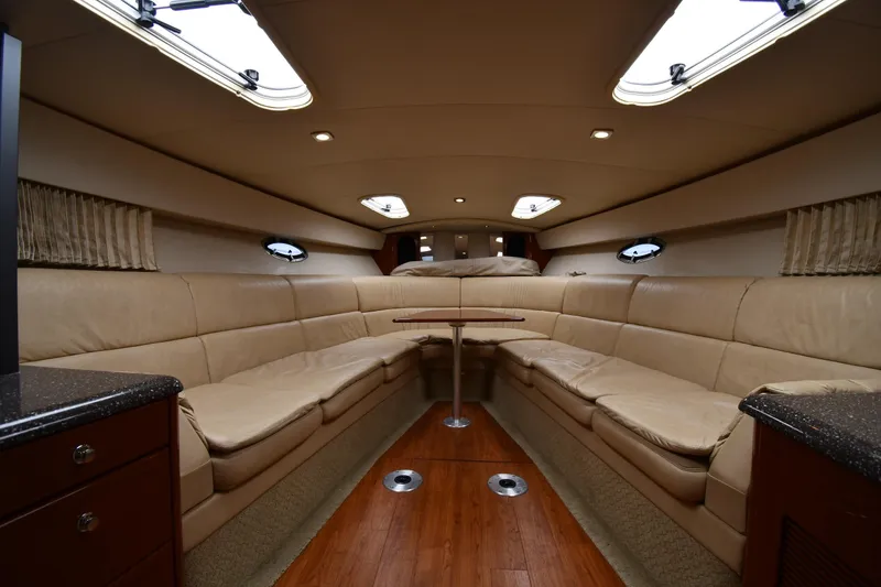 Slide: The Image of Luxurious interior of a 2009 Formula 400 Super Sport yacht with beige seating and wood flooring. - 29