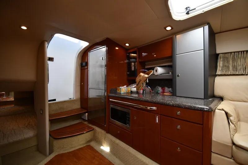 Slide: The Image of Luxurious interior of 2009 Formula 400 Super Sport yacht with modern kitchen amenities. - 34