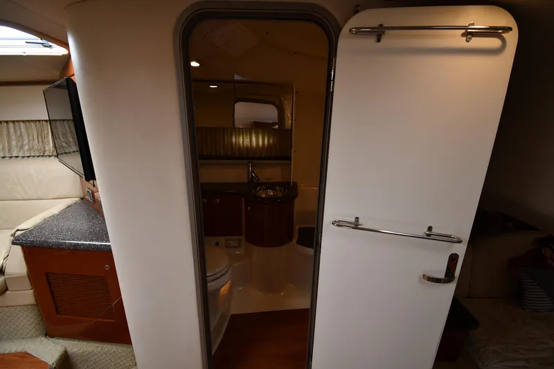 Slide: The Image of Interior of 2009 Formula 400 Super Sport yacht, featuring bathroom and seating area. - 35