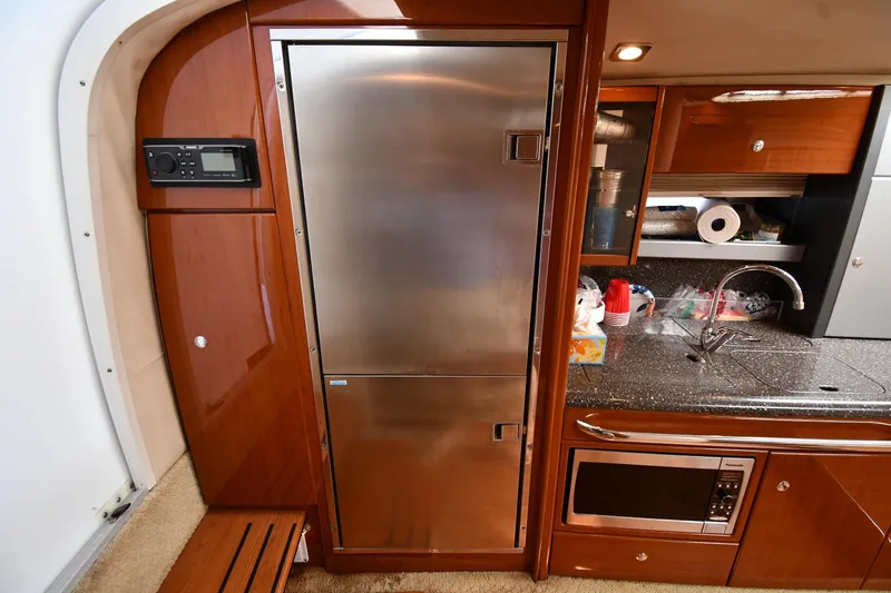 Slide: The Image of Luxurious 2009 Formula 400 Super Sport yacht kitchen with stainless steel fridge and modern amenities. - 40