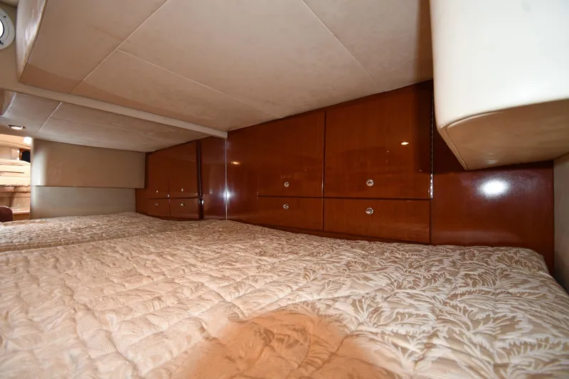Slide: The Image of Interior cabin of 2009 Formula 400 Super Sport with wood cabinetry and quilted bedding. - 43