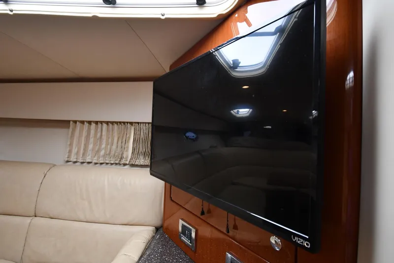 Slide: The Image of Interior of 2009 Formula 400 Super Sport with Vizio TV and beige seating. - 47