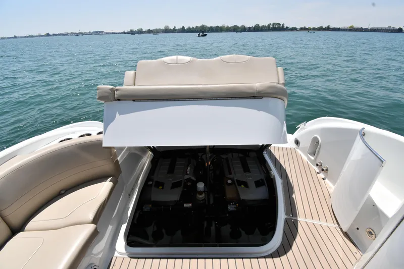 Slide: The Image of 2009 Formula 400 Super Sport boat with open engine compartment on a sunny day. - 50