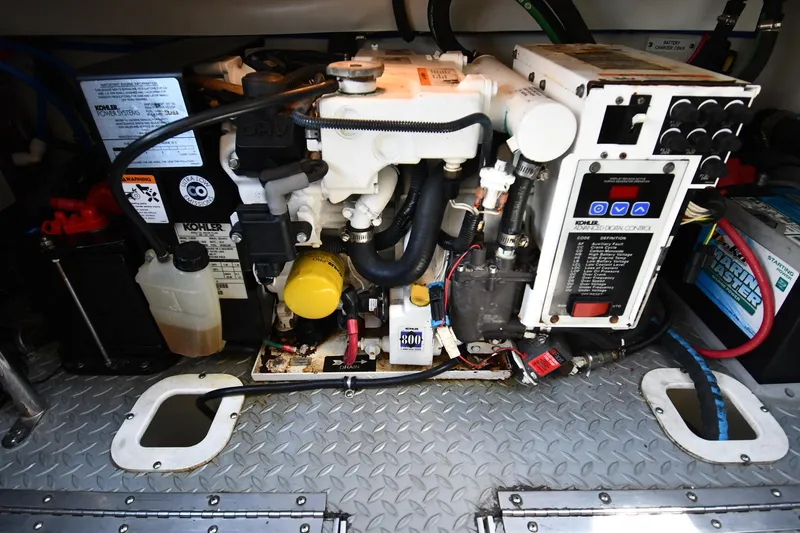 Slide: The Image of Engine compartment of a 2009 Formula 400 Super Sport boat with Kohler generator. - 54