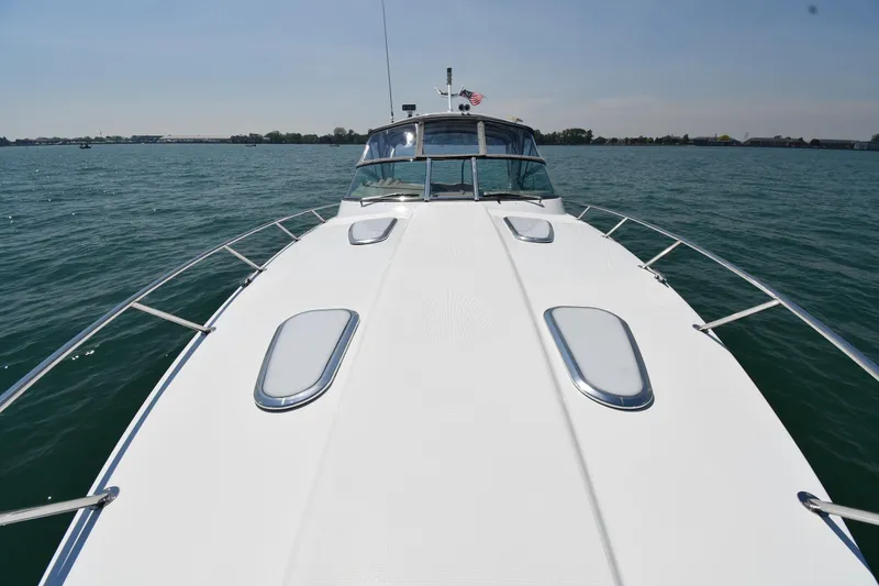 Slide: The Image of 2009 Formula 400 Super Sport boat cruising on open water under clear skies. - 9