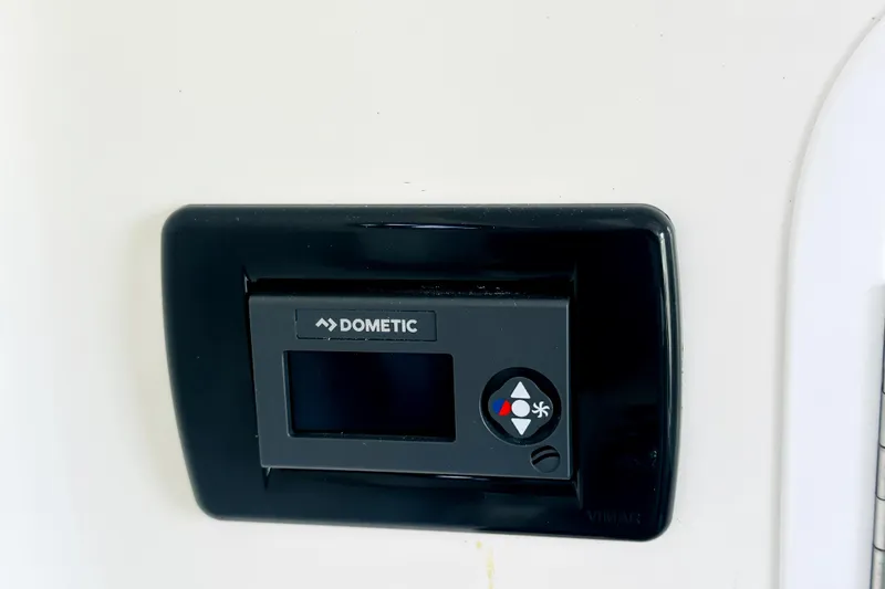 Slide: The Image of Dometic control panel on 2020 Regulator 34 boat, featuring temperature and fan settings. - 15