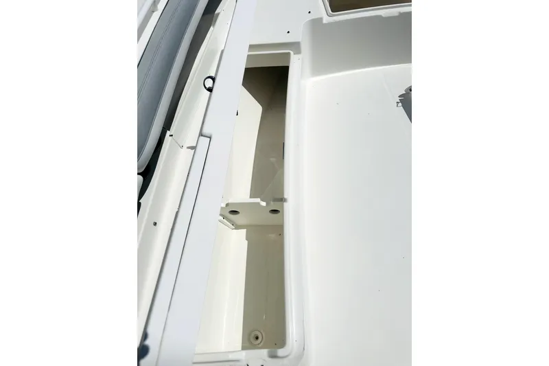 Slide: The Image of 2020 Regulator 34 boat storage compartment, open and empty, showcasing interior space. - 17