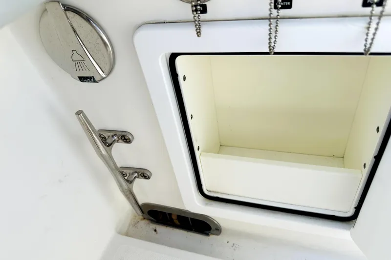 Slide: The Image of 2020 Regulator 34 boat compartment with shower control and cleat. - 18