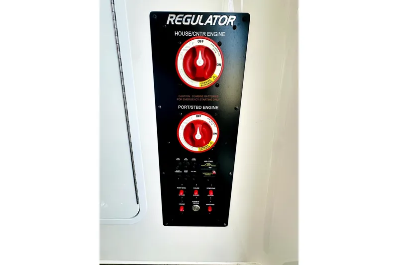 Slide: The Image of Control panel of a 2020 Regulator 34 boat with engine switches. - 20