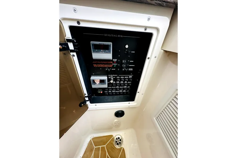 Slide: The Image of Electrical panel inside 2020 Regulator 34 boat, featuring switches and controls. - 22