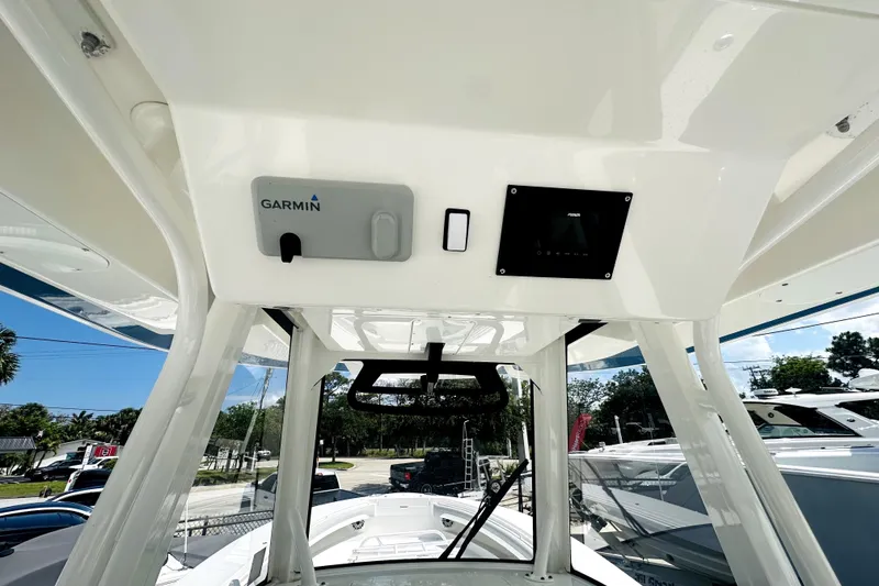 Slide: The Image of 2020 Regulator 34 boat console with Garmin electronics and modern design. - 6