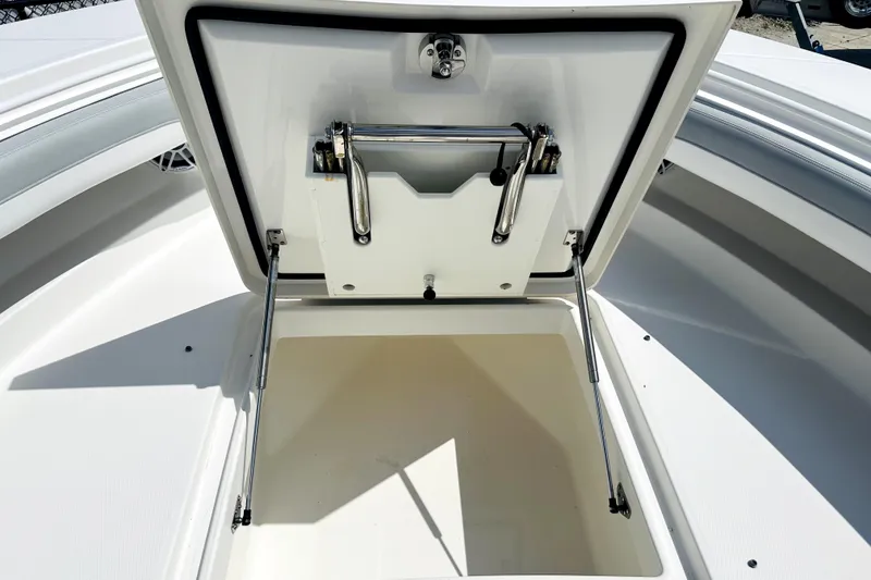 Slide: The Image of Open storage compartment on a 2020 Regulator 34 boat, showcasing interior space and hardware. - 9