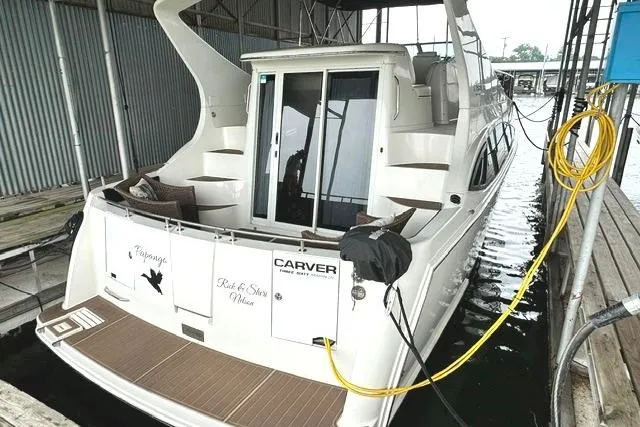 Slide: The Image of 2004 Carver 360 Mariner docked in a covered marina slip. - 2
