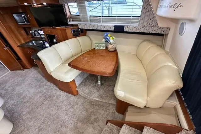 Slide: The Image of Interior of 2004 Carver 360 Mariner with cozy dining area and modern amenities. - 23