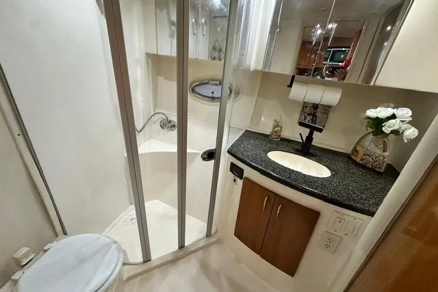 Slide: The Image of Bathroom interior of 2004 Carver 360 Mariner yacht with shower, sink, and toilet. - 30