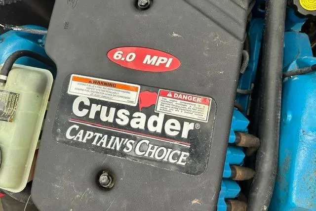 Slide: The Image of Engine of 2004 Carver 360 Mariner with Crusader Captain's Choice 6.0 MPI label. - 33