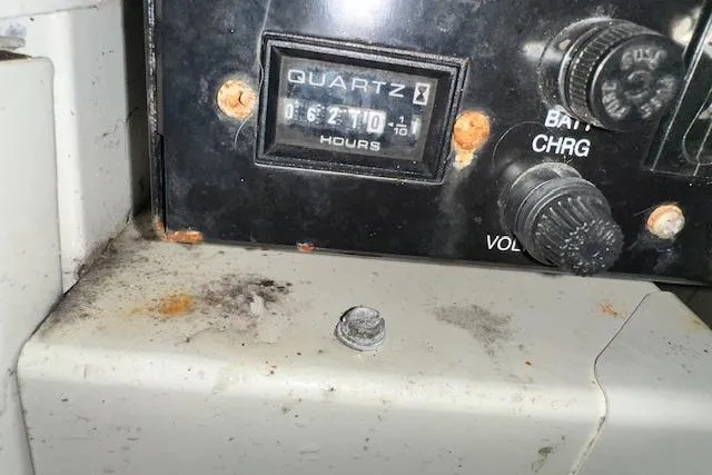 Slide: The Image of Control panel of a 2004 Carver 360 Mariner with hour meter and battery charge knob. - 36