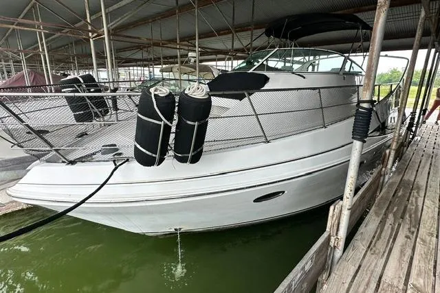 Slide: The Image of 2004 Carver 360 Mariner docked in a covered marina. - 4