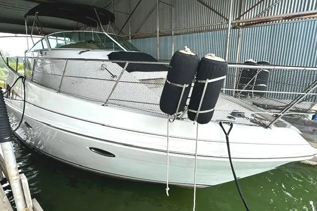 Slide: The Image of 2004 Carver 360 Mariner yacht docked in a covered marina. - 5