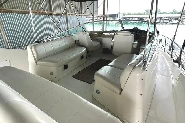 Slide: The Image of 2004 Carver 360 Mariner boat interior with white seating and helm station. - 7