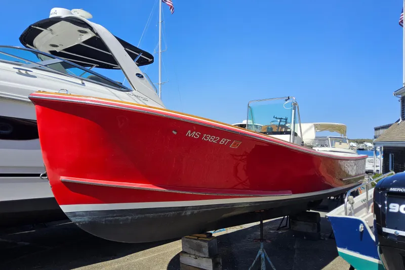 The Image of Red 2010 Grey Barn Boatworks North Shore 22 boat on display at marina. - 0