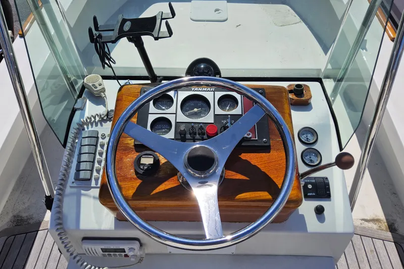 Slide: The Image of Steering console of 2010 Grey Barn Boatworks North Shore 22 with Yanmar controls. - 12