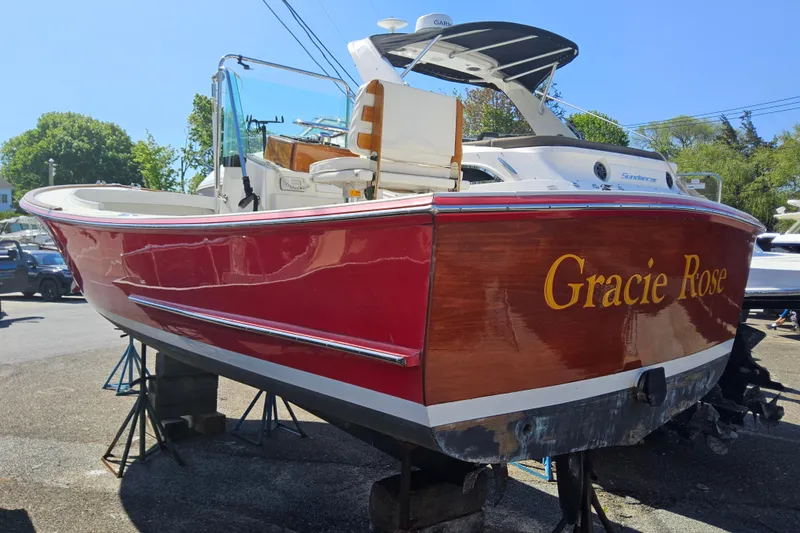 Slide: The Image of Red and white 2010 Grey Barn Boatworks North Shore 22 named "Gracie Rose" on display. - 4