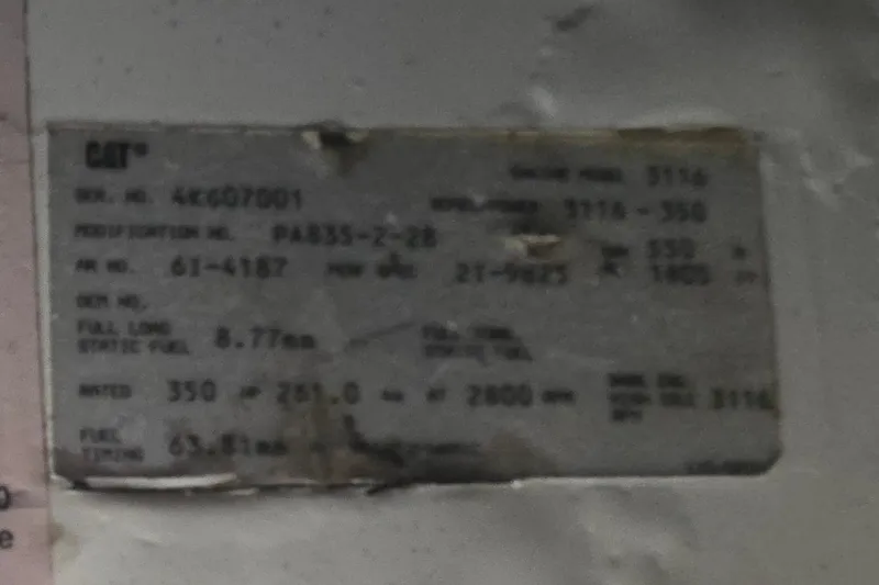 Slide: The Image of 1998 Sea Ray 370 Express Cruiser engine specification label, displaying technical details and serial numbers. - 24