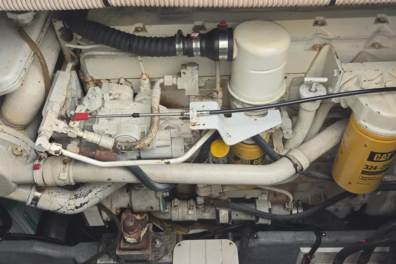 Slide: The Image of Engine compartment of a 1998 Sea Ray 370 Express Cruiser with visible CAT filters. - 27