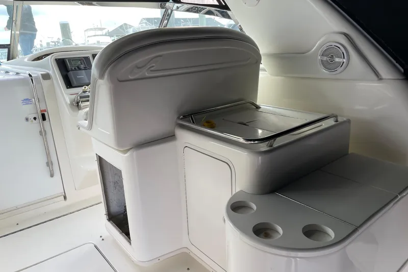 Slide: The Image of 1998 Sea Ray 370 Express Cruiser interior with helm and seating area. - 4