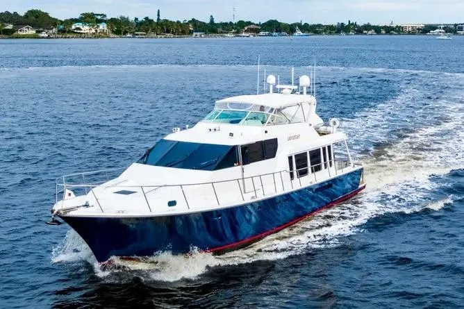 Slide: The Image of 2000 Pacific Mariner 65 Motoryacht cruising on open water, showcasing sleek design and luxury. - 28