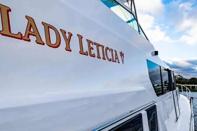 Slide: The Image of 2000 Pacific Mariner 65 Motoryacht "Lady Leticia" with scenic water backdrop. - 41