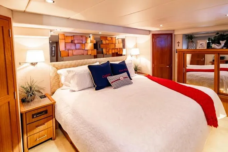 Slide: The Image of Luxurious bedroom interior of 2000 Pacific Mariner 65 Motoryacht with elegant decor and cozy bedding. - 53