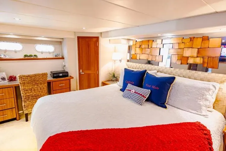 Slide: The Image of Luxurious bedroom interior of 2000 Pacific Mariner 65 Motoryacht with modern decor and cozy bedding. - 54