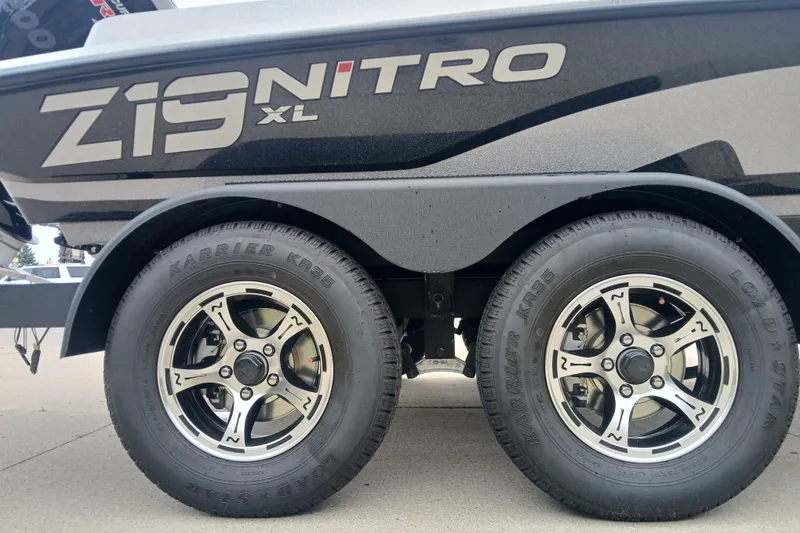 Slide: The Image of 2026 Nitro Z19 XL boat trailer with dual wheels and Karrie KR35 tires. - 7